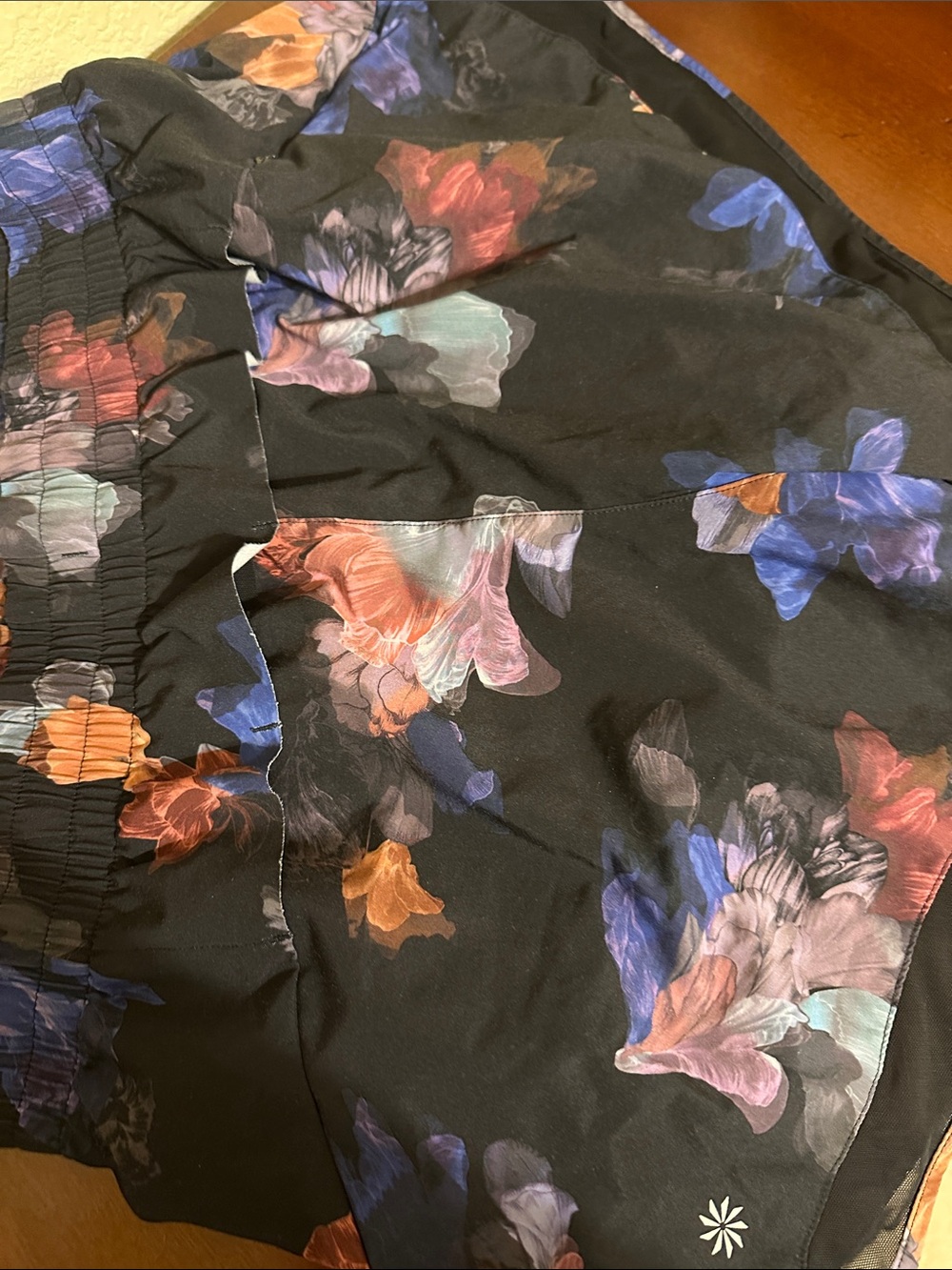 Athleta mesh racer run 4 inch Black Floral Print Shorts with Multicolor  Design